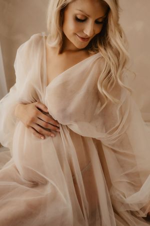 Ethereal portrait series featuring figure in flowing white fabric with romantic, minimalist aesthetic in warm tones.