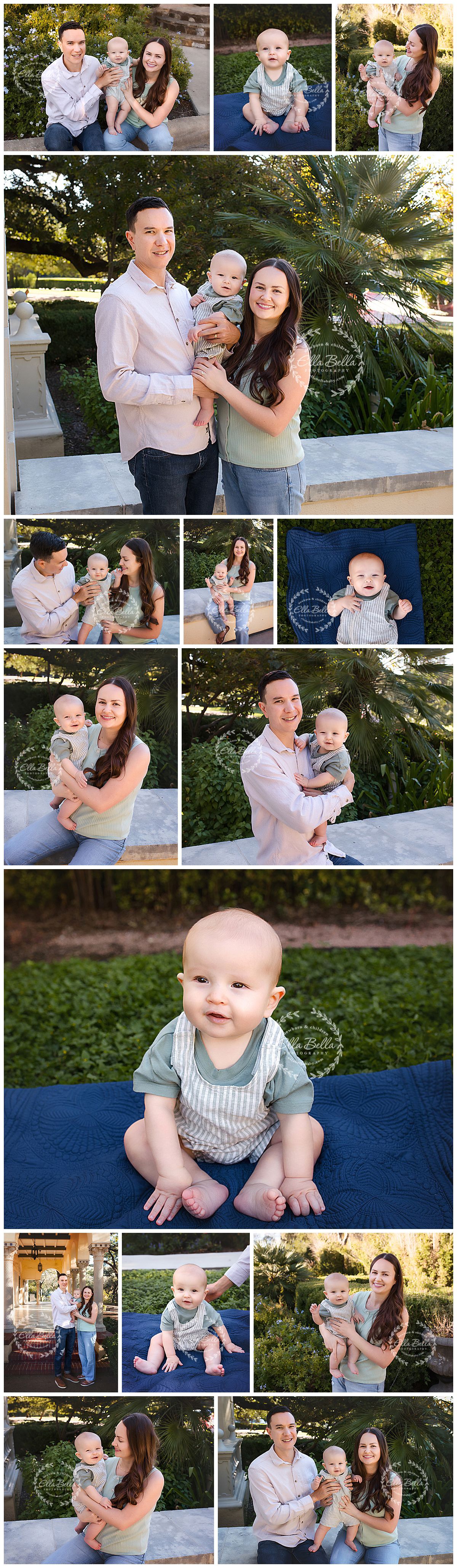 Parents smile outdoors on a stone ledge with their baby in a family portrait session surrounded by greenery and palm trees.