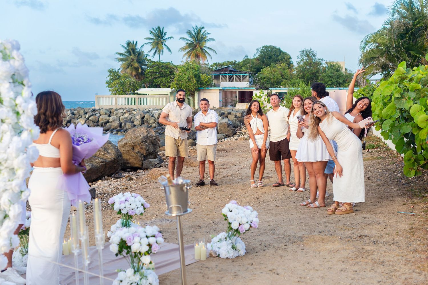 Marriage proposal. Woman, family members, and decorative setup overlooking the ocean in Río Grande, Puerto Rico.