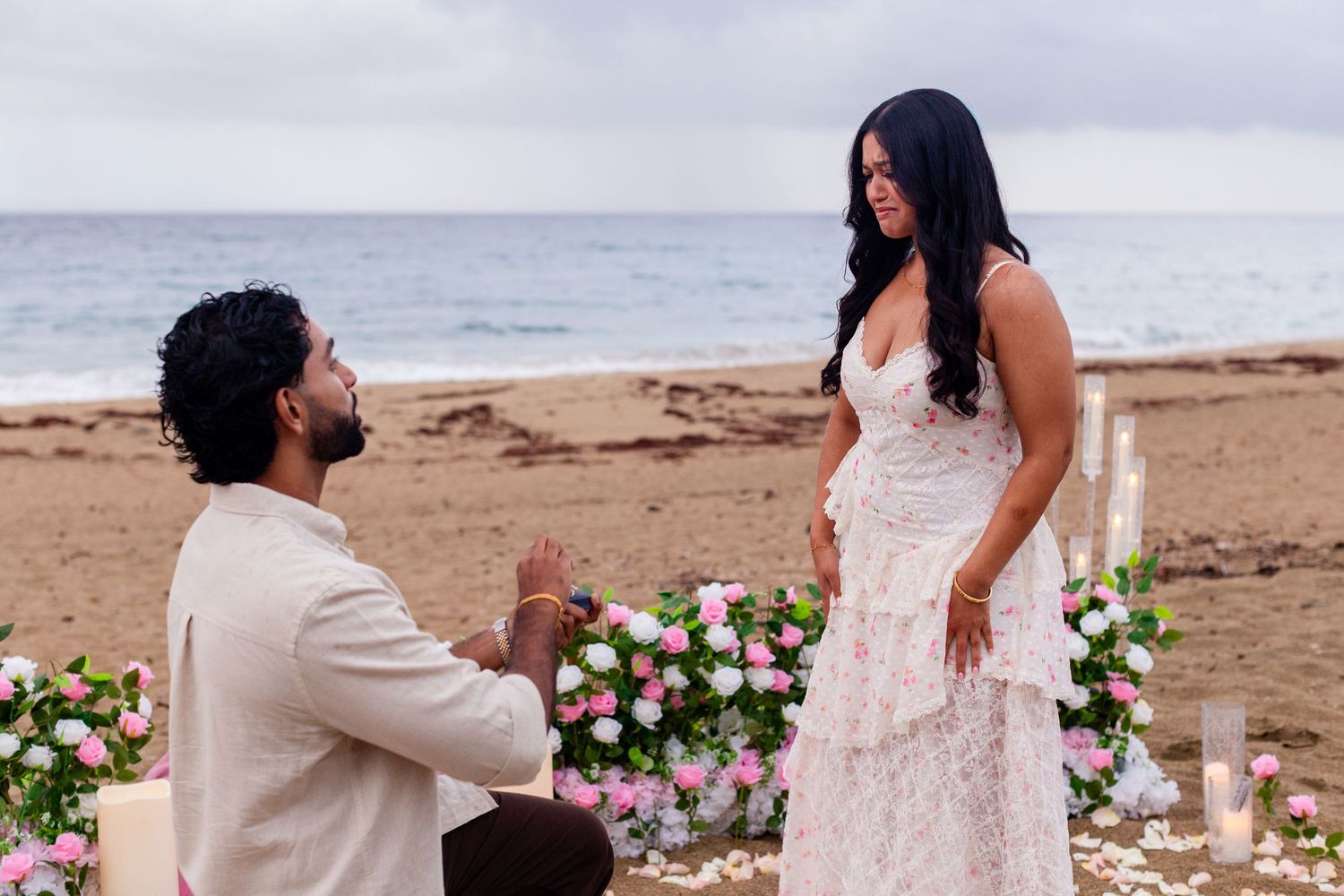 Marriage proposal on the beach with flowers and candles. Playa Guajataca, Isabela, Puerto Rico.