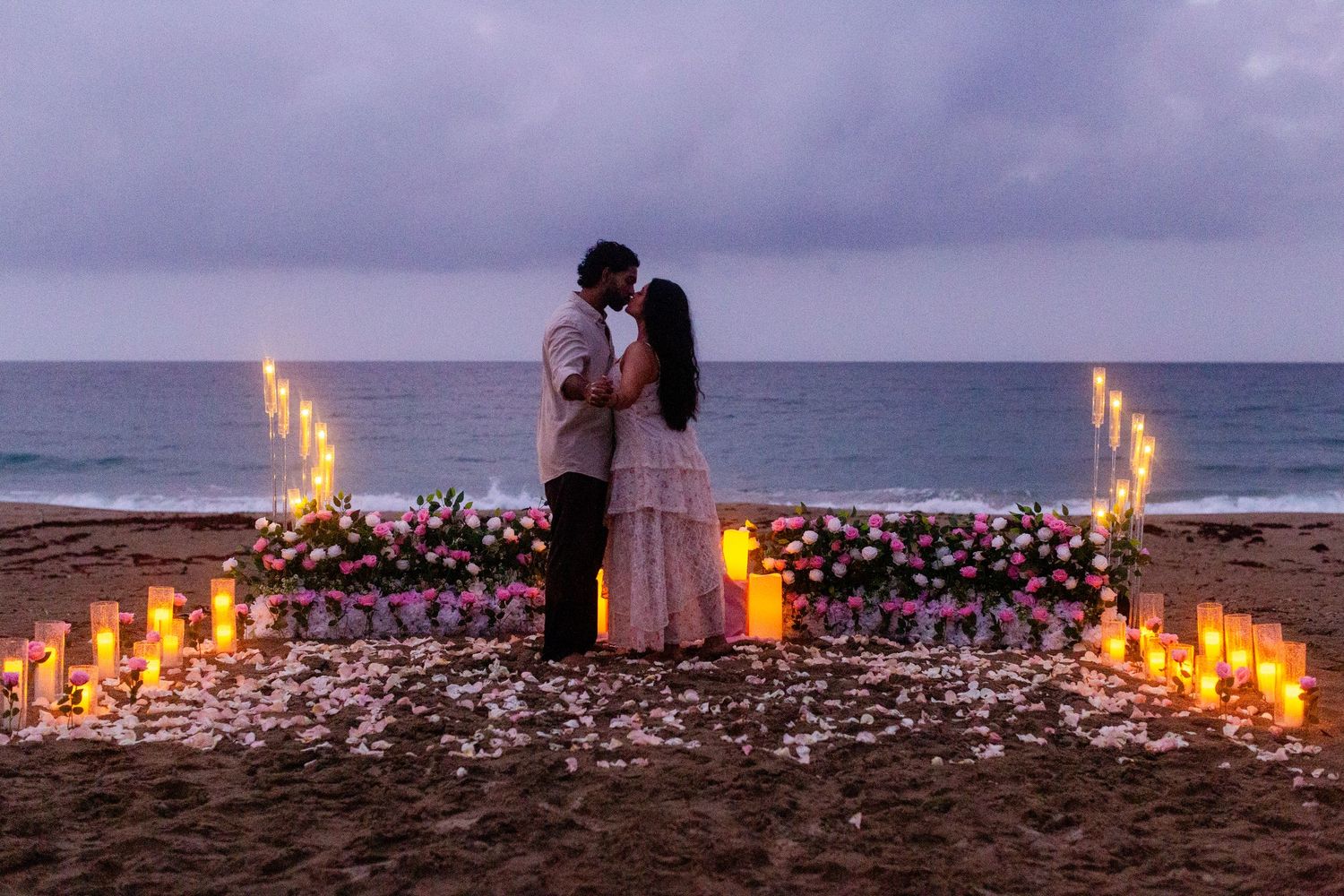 Marriage proposal on the beach with flowers and candles. Playa Guajataca, Isabela, Puerto Rico.
