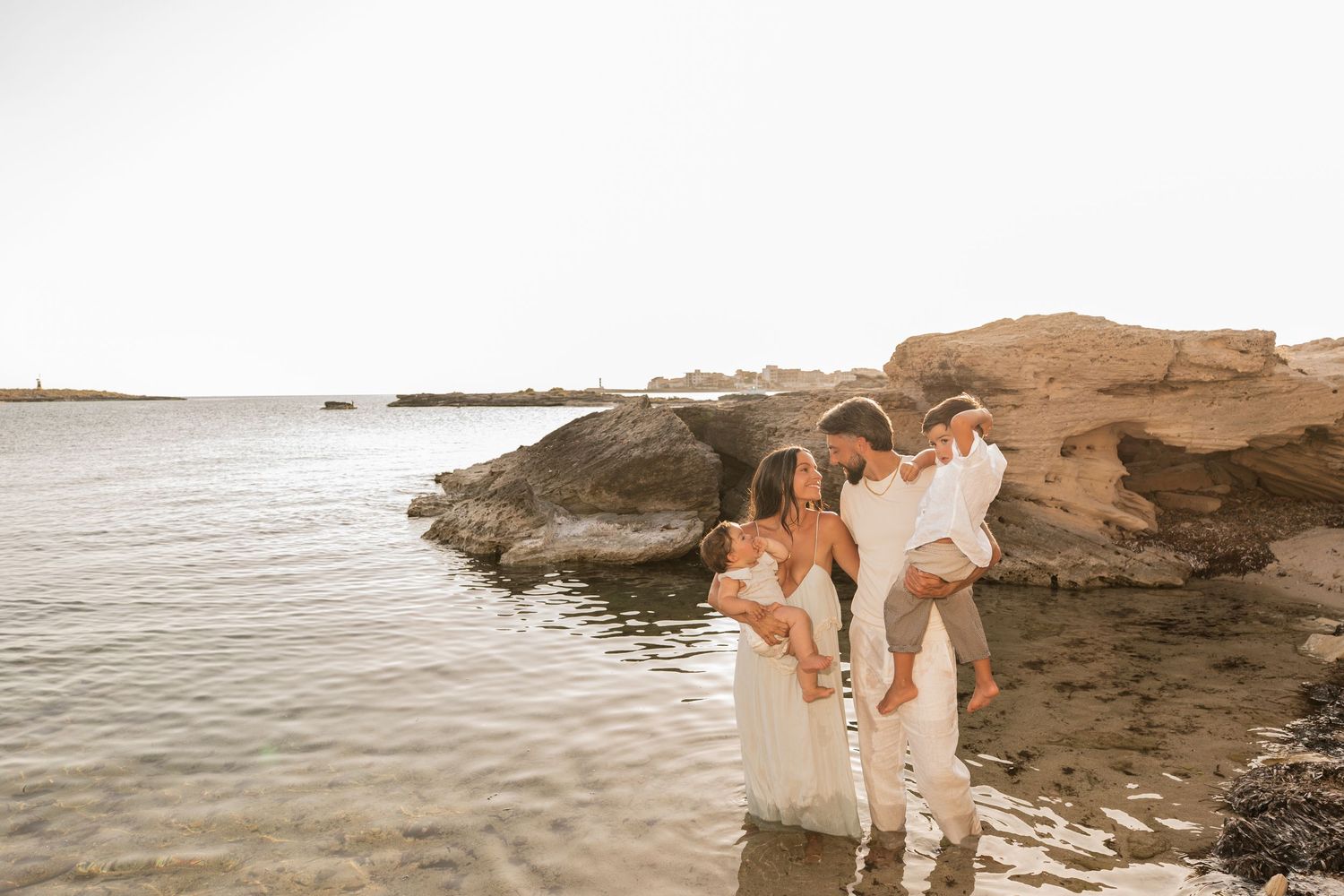 A family enjoying their time on the beach in Mallorca in Colonia de Sant Jordie.