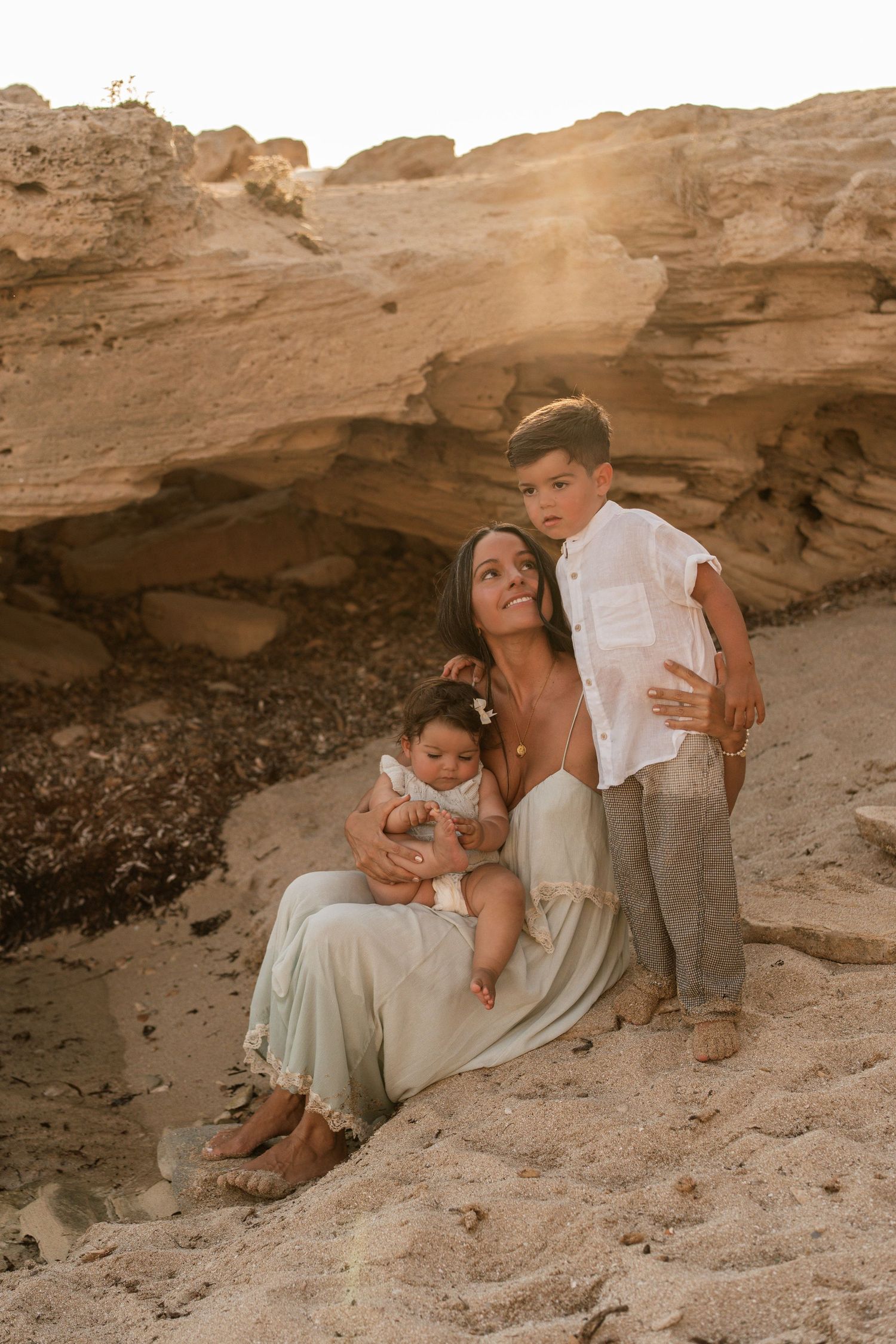 A mum and her two kids enjoying their time on the beach in Mallorca in Colonia de Sant Jordie.