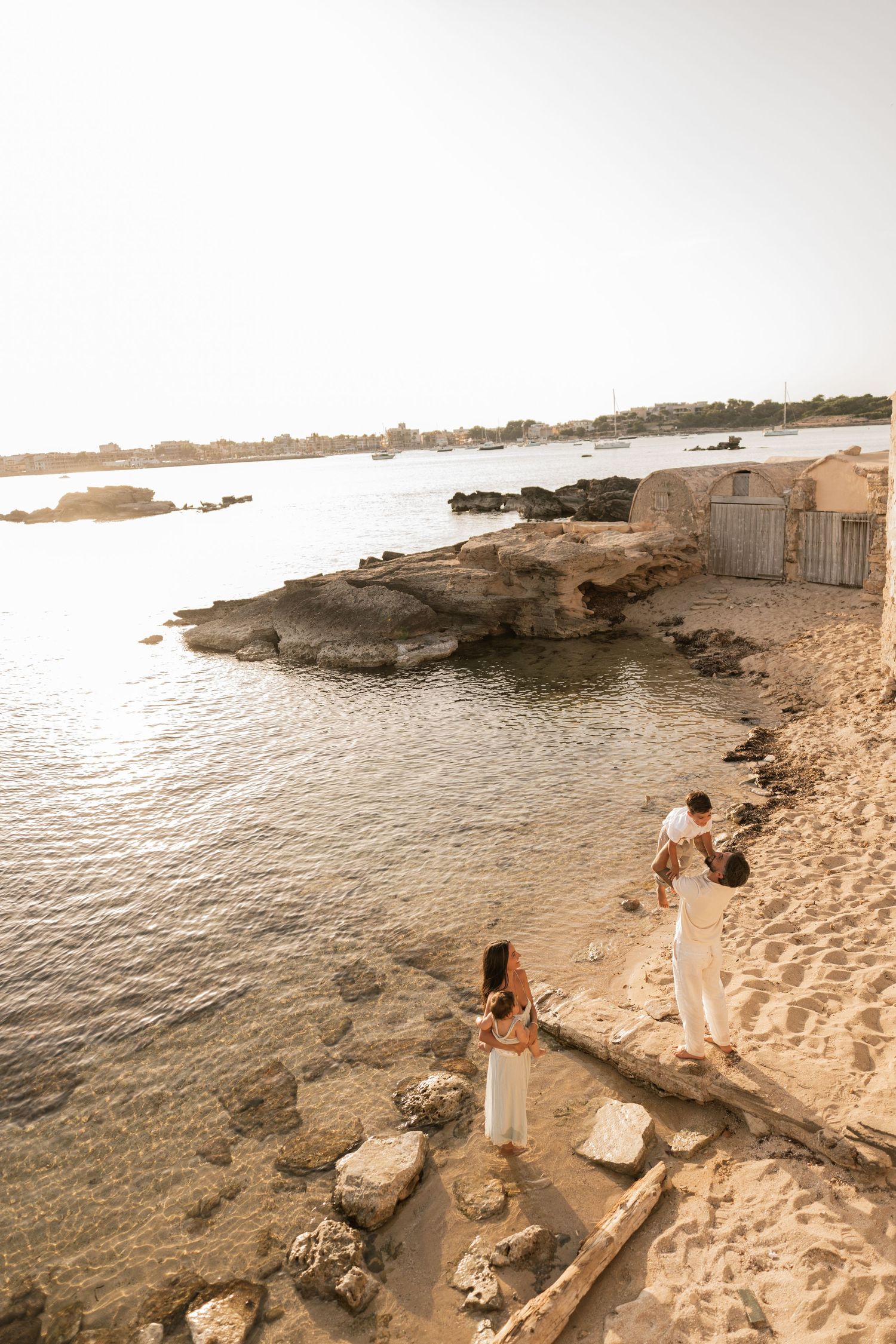 A family enjoying their time on the beach in Mallorca in Colonia de Sant Jordie.