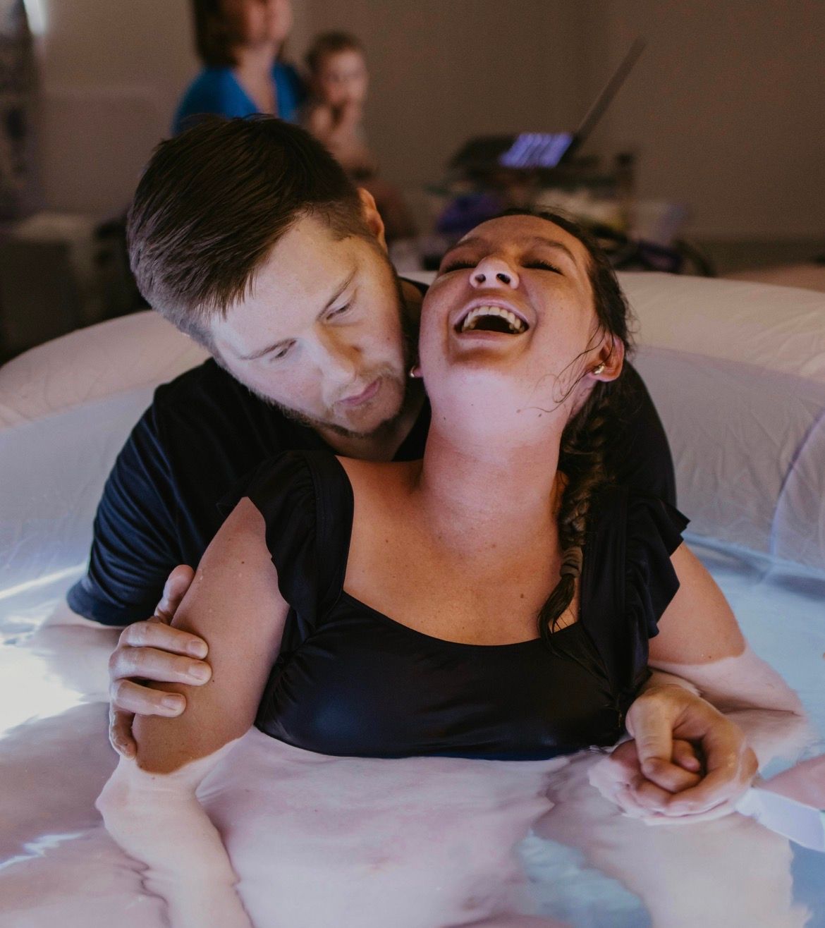 woman giving birth at home