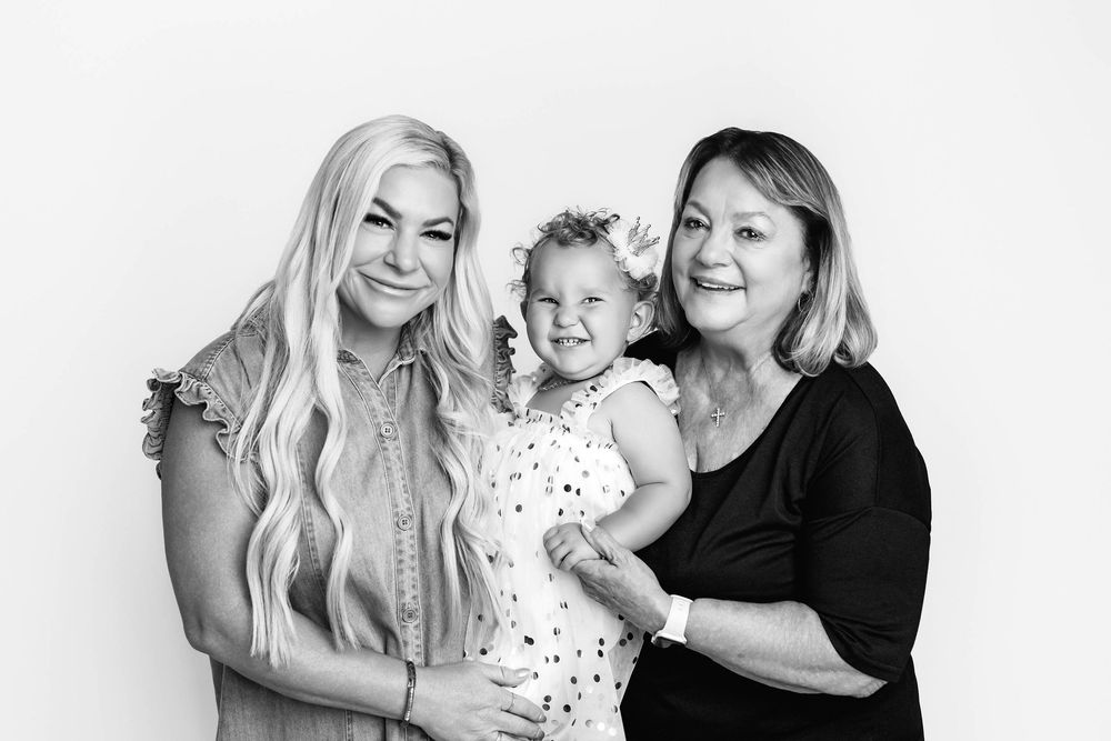 Three generation black and white portrait of mom, grandma, and little girl in Riverside county studio.