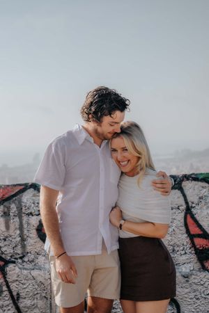 Couple standing together overlooking Barcelona from Carmel Bunkers