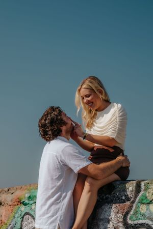 Couple holding hands at Carmel Bunkers overlooking Barcelona