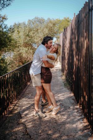 Couple embracing with panoramic Barcelona views at Carmel Bunkers