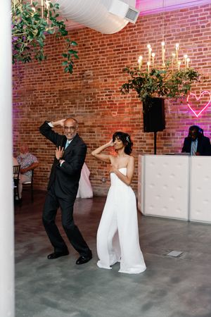 Bride dancing with Father at her wedding. The Elia Wilmington NC Weddings
