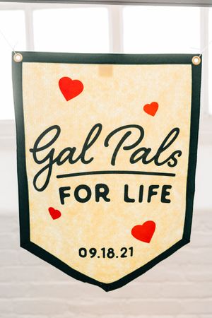 Wedding banner signs with hearts and date reading 'For Life 09.18.21' in black and cream colors.