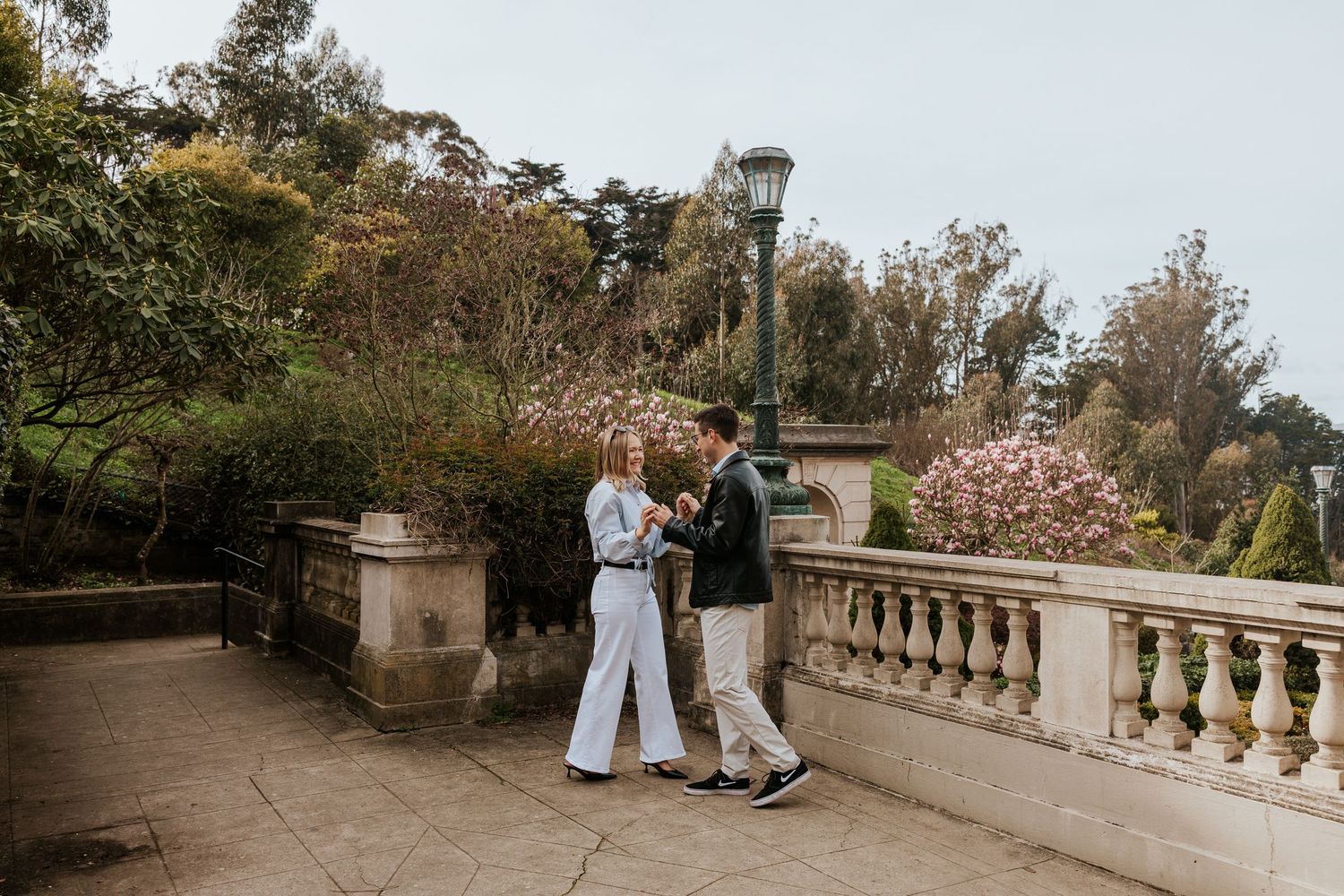 couple walk around the lyon street steps in san francisco. bay area engagement photographer