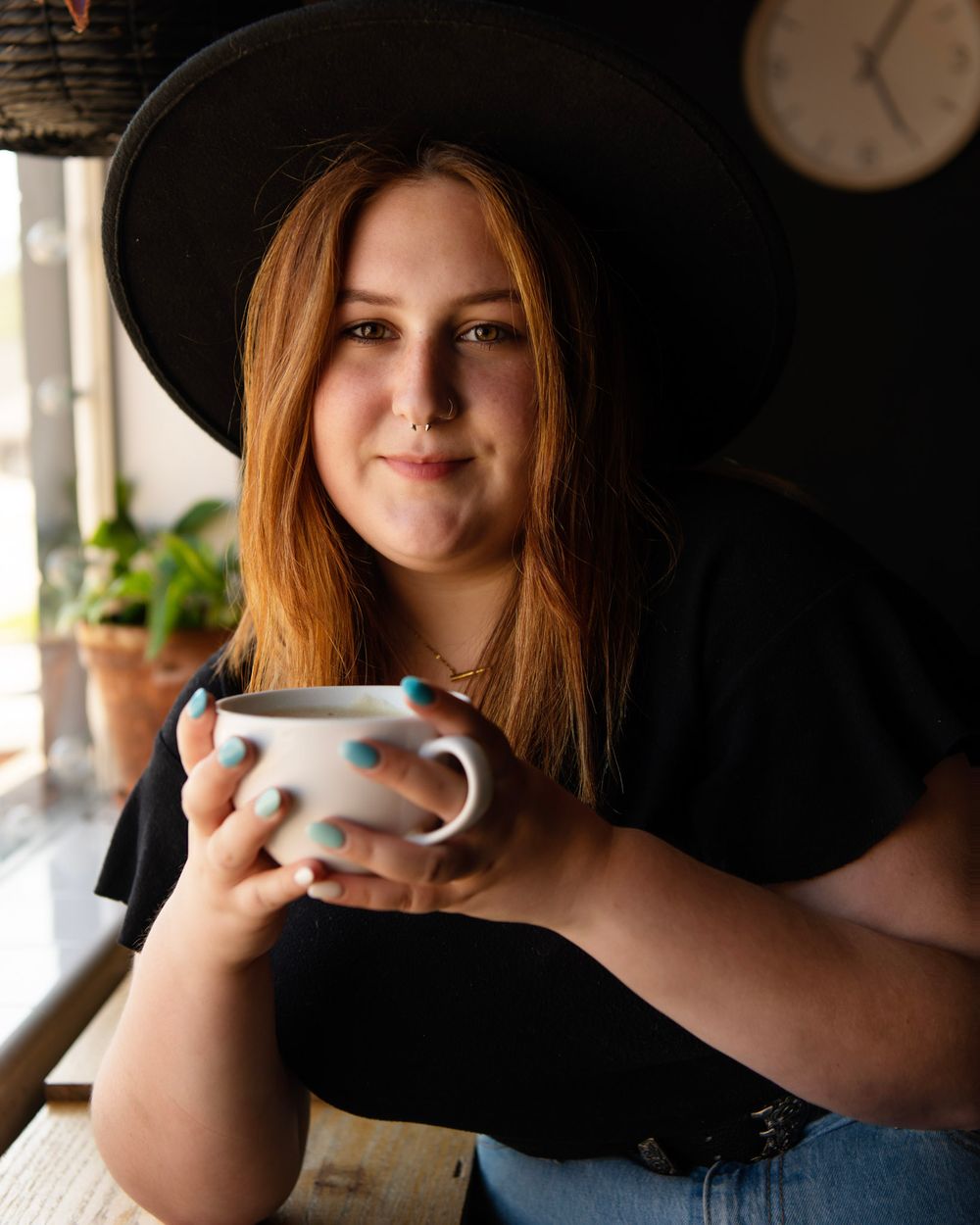 Lifestyle senior portrait of a graduating high school senior relaxing in a cozy St. Petersburg Florida café.