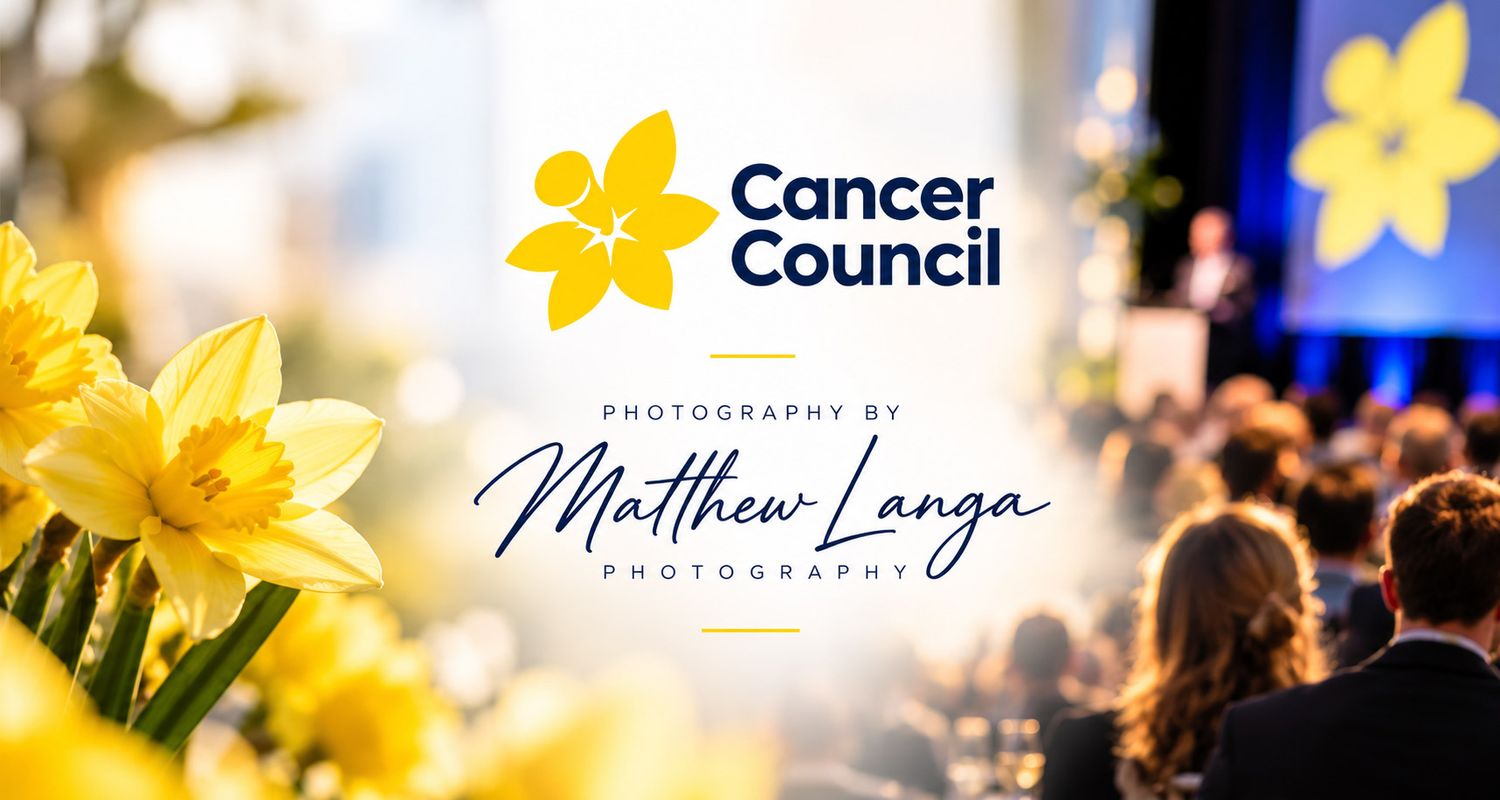 Cancer Council logo with yellow daffodils beside an audience seated at a fundraising event, photography by Matthew Langa.