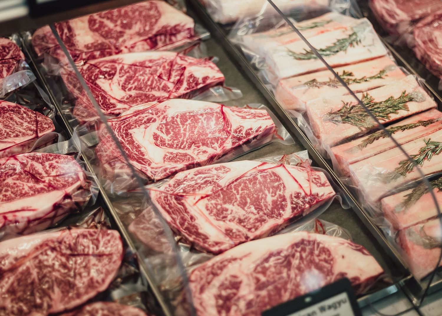 Panning shot of steaks on a meat counter