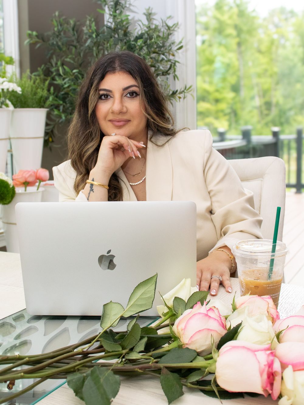 Florist branding headshot of woman working at her computer in Strongsville.
