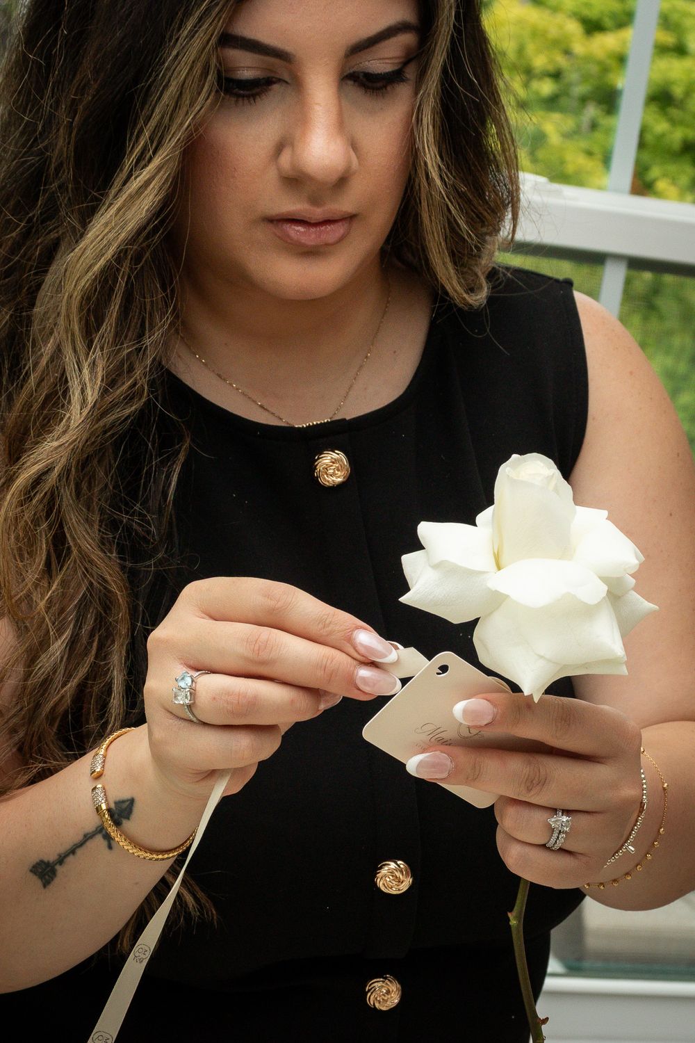 A florist handling her business card and flower in Strongsville.