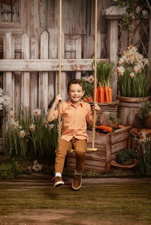 Spring garden scene with rustic wooden fence, potted flowers, carrots and a rope swing against weathered wood backdrop.