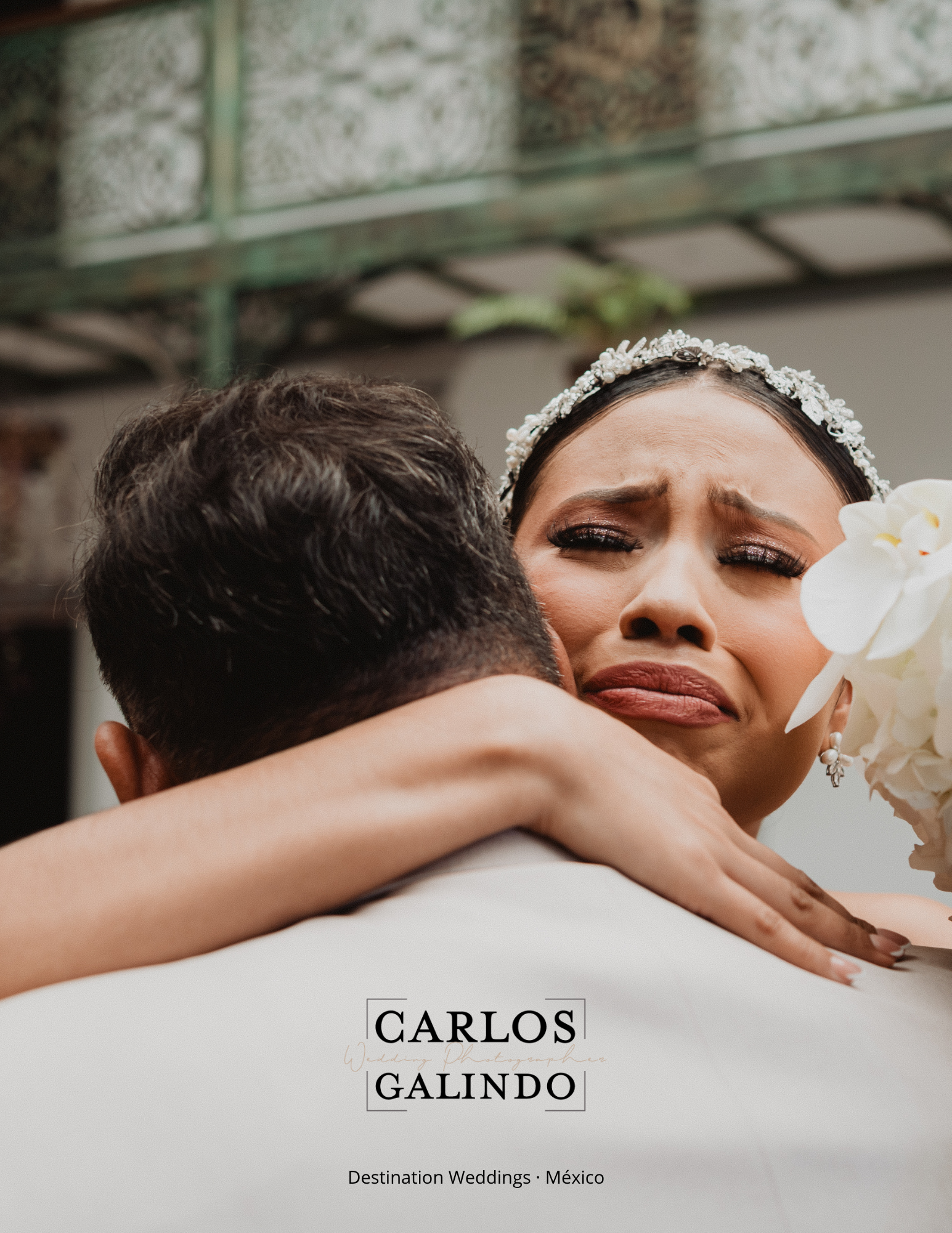 Emotional bride embracing someone during a destination wedding in Mexico.