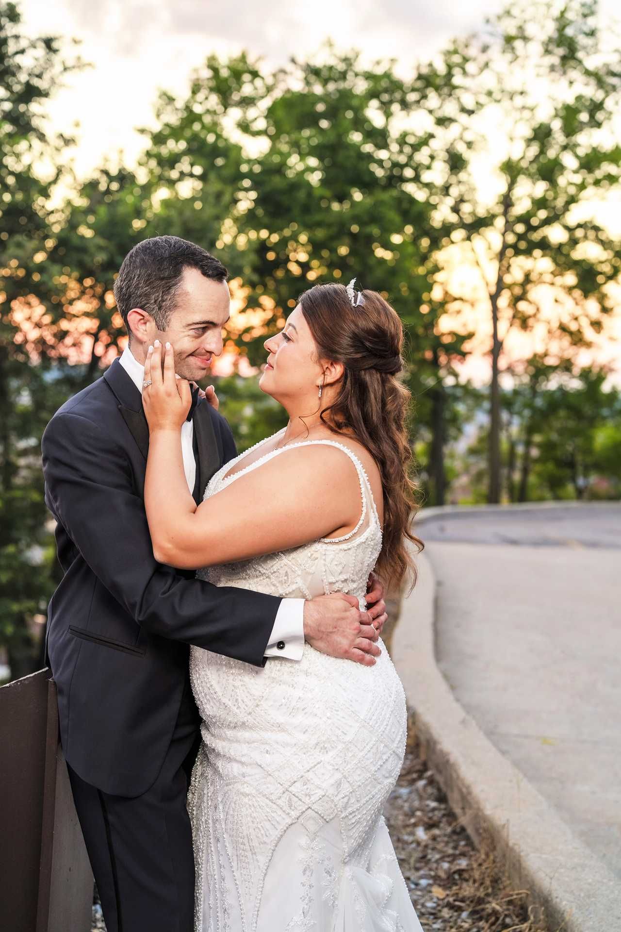 Bride and groom share a romantic kiss at the view wedding venue