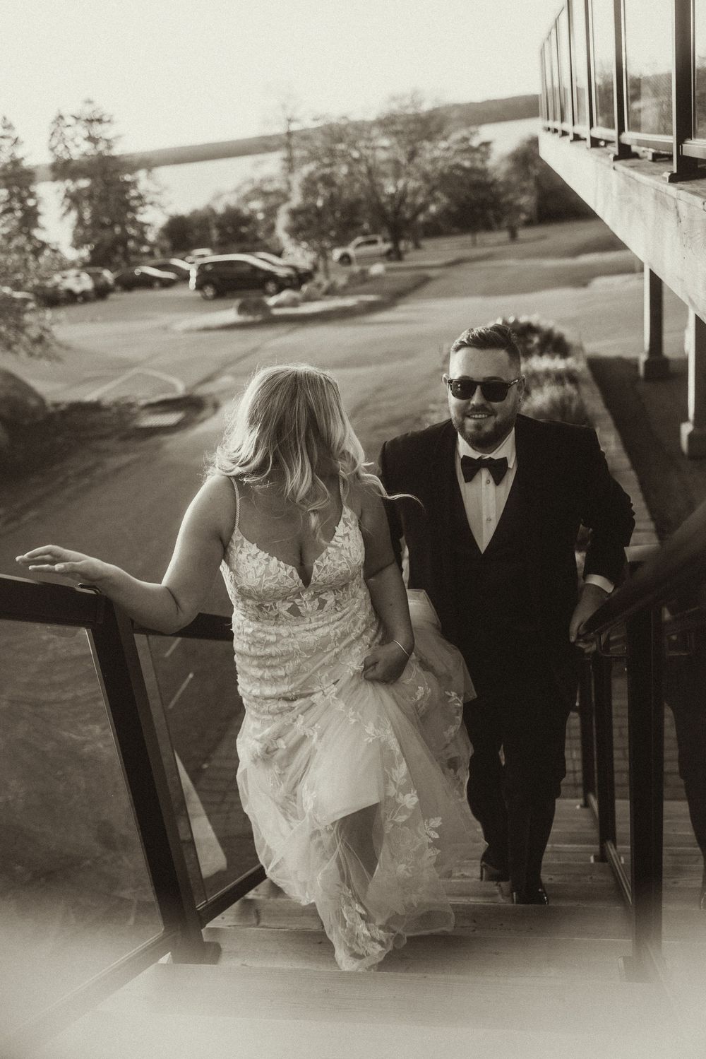 Black and white wedding photos showing couple walking together in formal attire.