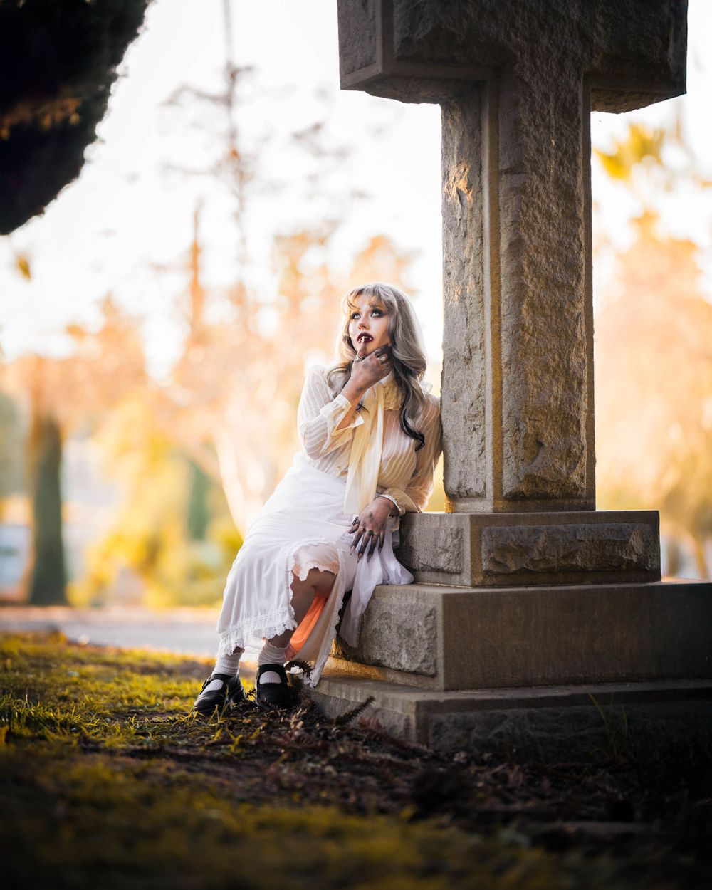 female model vampire in a cemetery horror photoshoot at sunset with photographer ChrisCornishPhotography