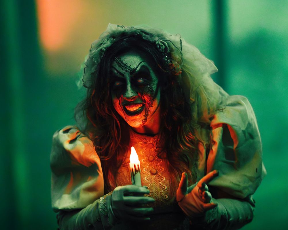 Portrait of a Knott’s Scary Farm monster in full costume and makeup during Halloween season, captured by Chris Cornish Photography.