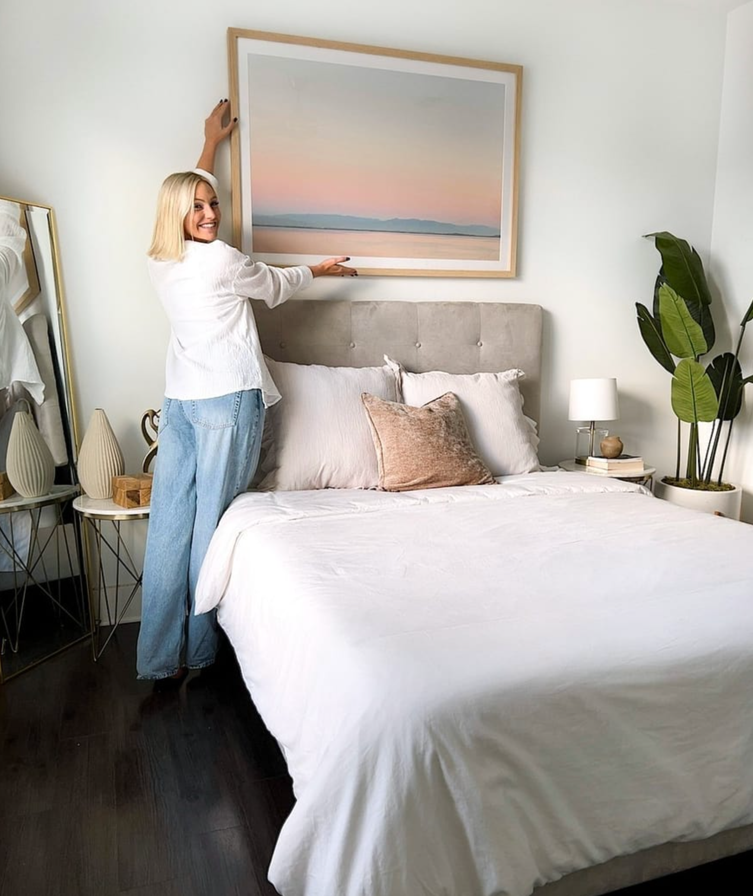 Six images showing a minimalist bedroom interior with white bedding, beige accents, and modern wall art in light wood frames.