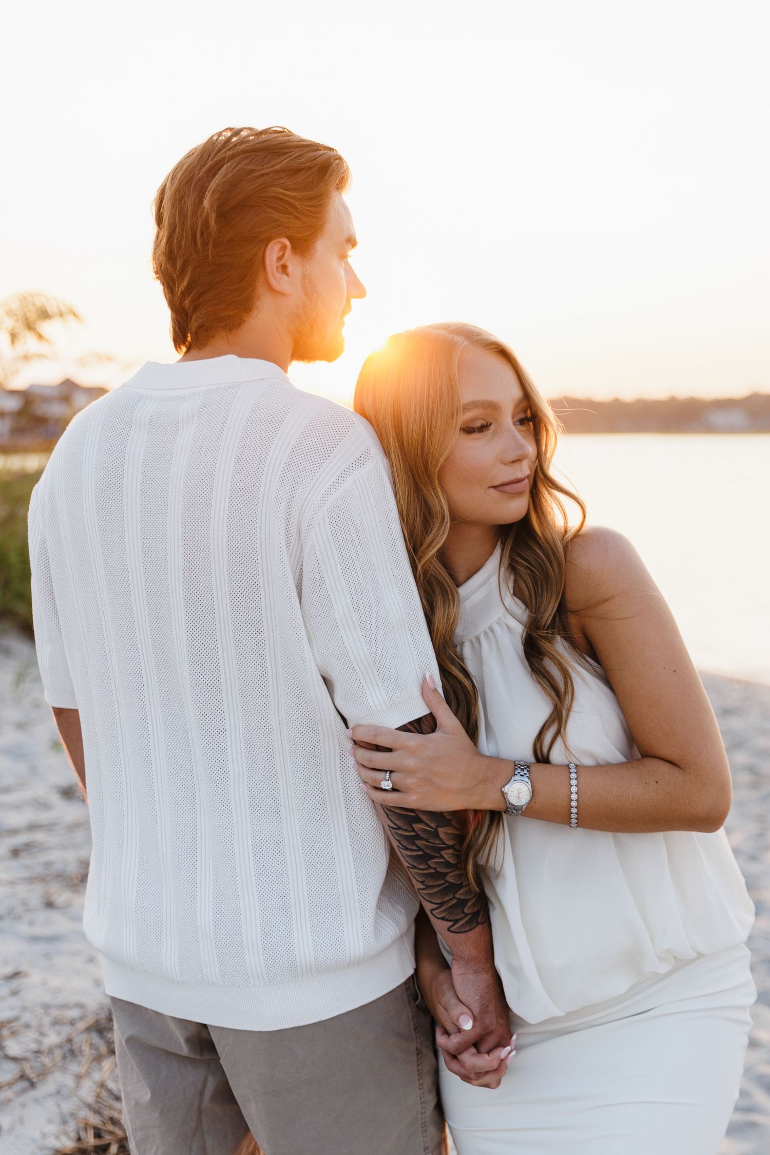 Wedding portraits in a tropical garden setting with palm trees and natural sunlight.