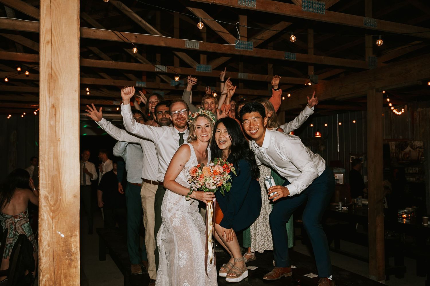 Couple couple laughing with bridal party Vancouver Island at Smith Lake Farm barn venue. Photography by Photographer Soulfull Photographs