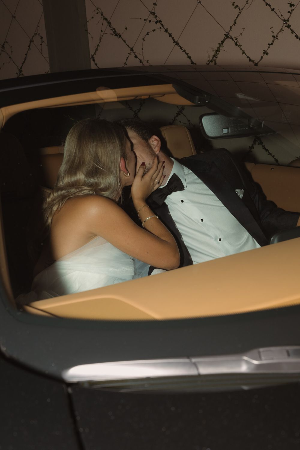 Elegant wedding car ready for newlyweds to drive off after the ceremony