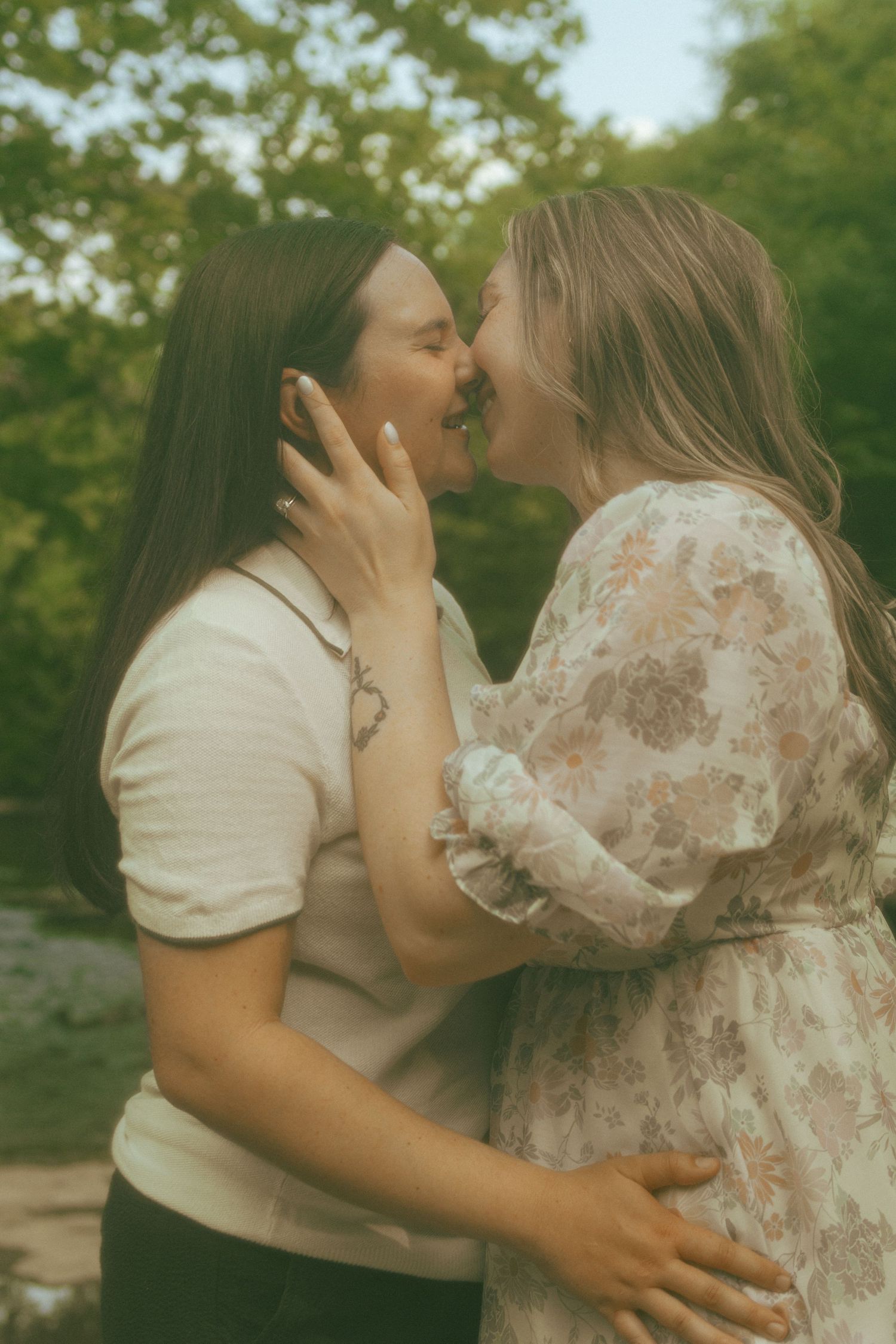 Black and white portrait capturing tender moment between couple.