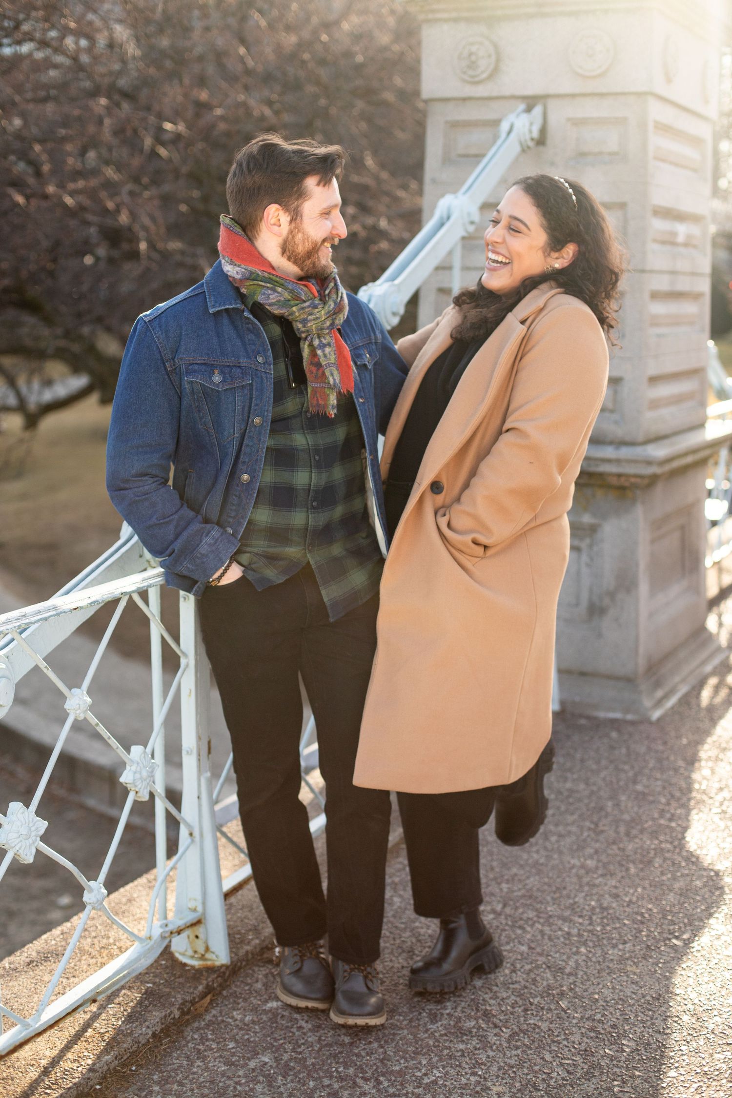 smiling couple on boston public garden bridge, candid photo
