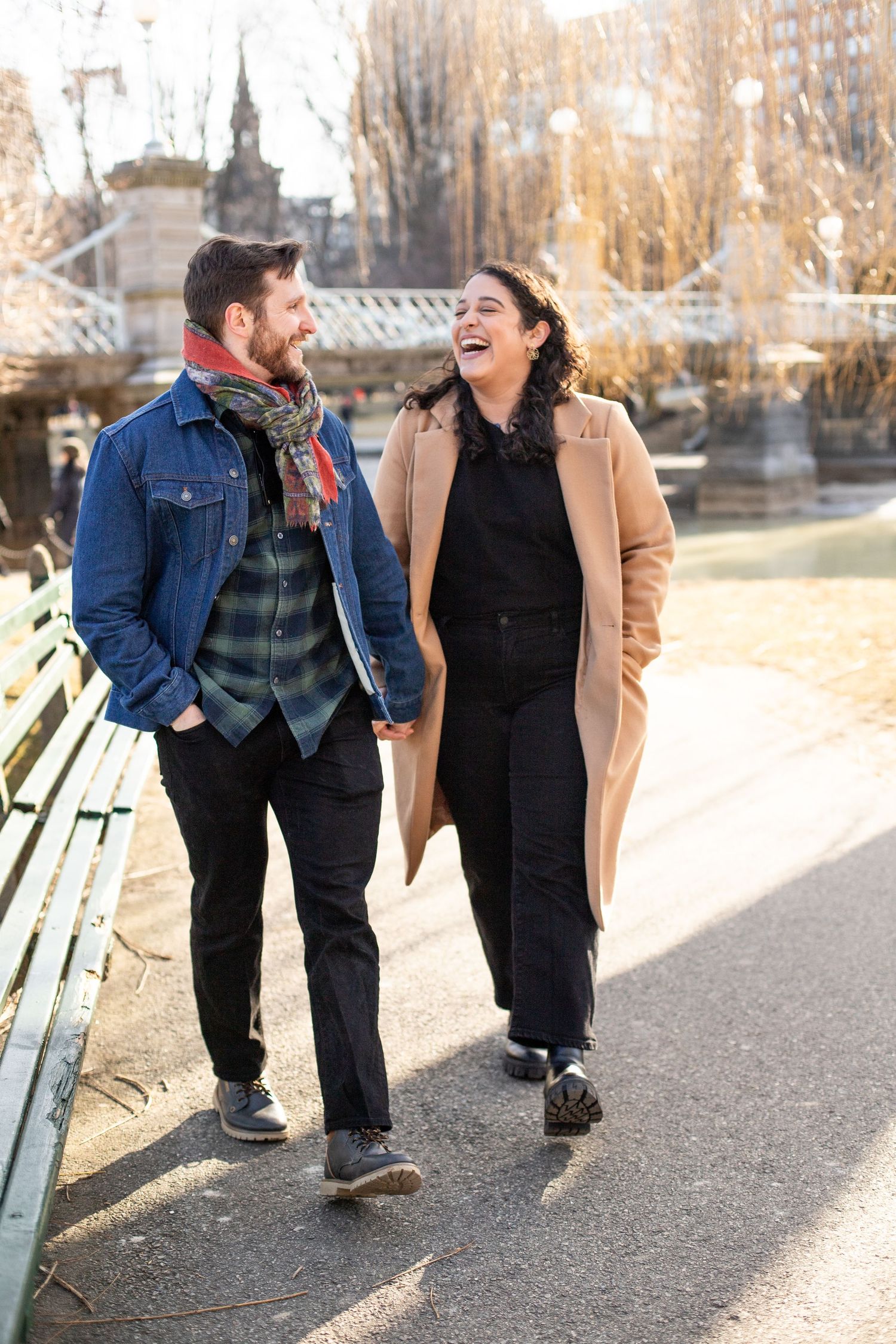 candid photo couple strolling through boston public garden during winter
