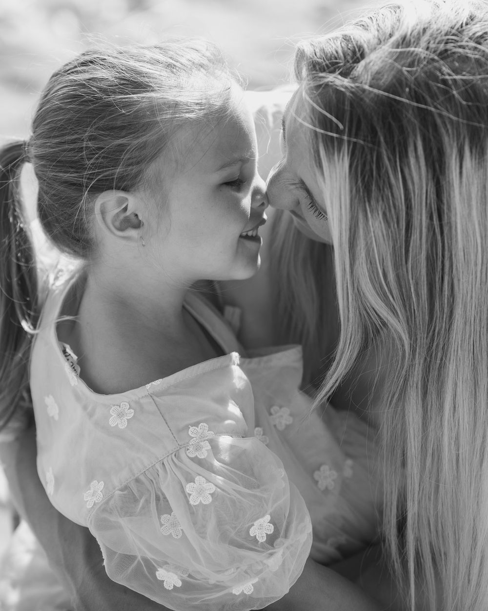 mother and daughter sharing a hongi
