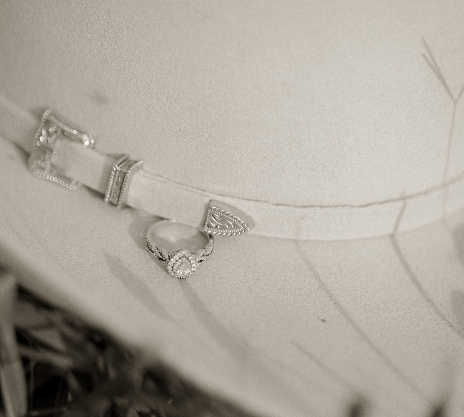 Elegant wedding jewelry and accessories photographed in soft focus.