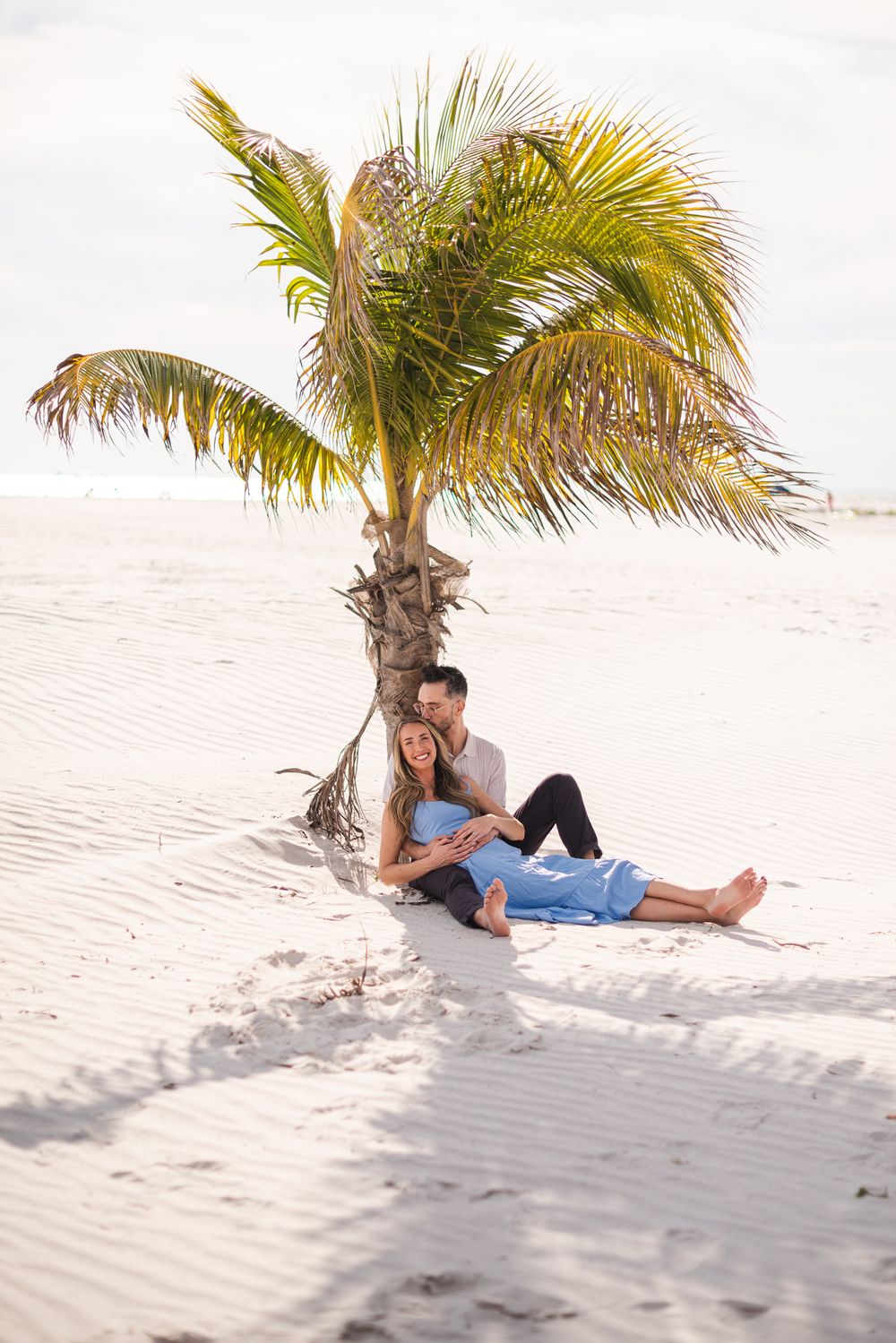 Family photos with palm trees and sunshine. Light and Airy photo style.  Book a portrait session on the beach. Where is the closest Beach.