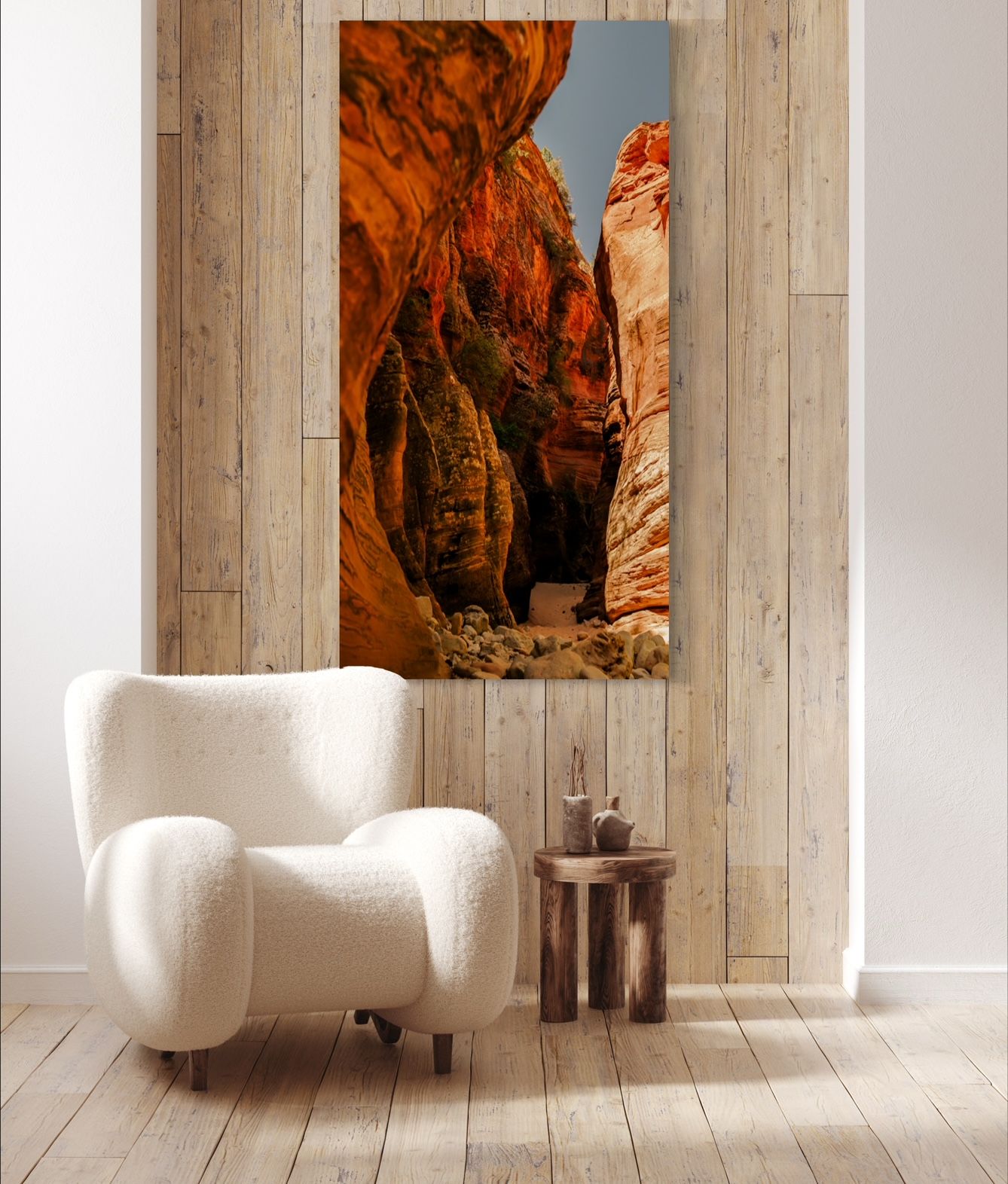 Red rock canyon landscape artwork displayed above white accent chair in modern interior.