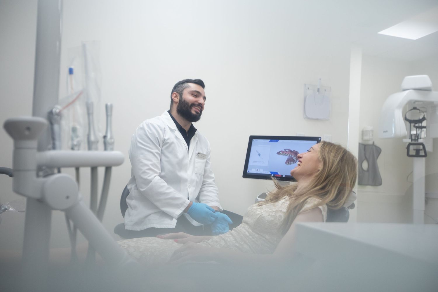 Dental examination in progress showing modern equipment and treatment room.