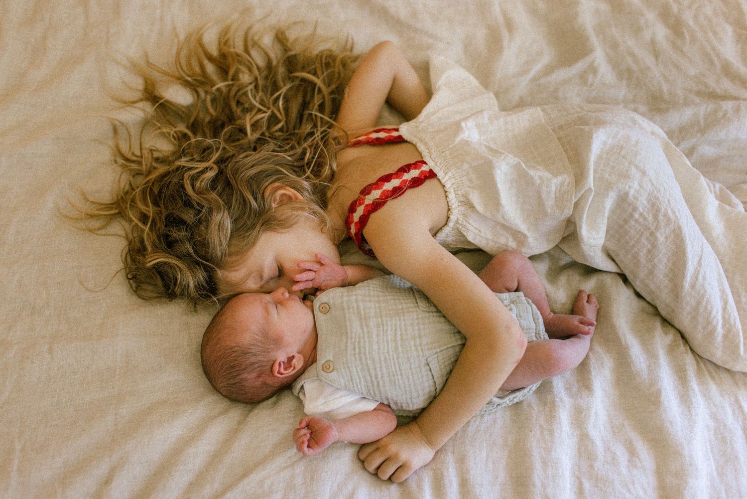 Intimate family portrait sequence in warm sepia tones showing tender moments.