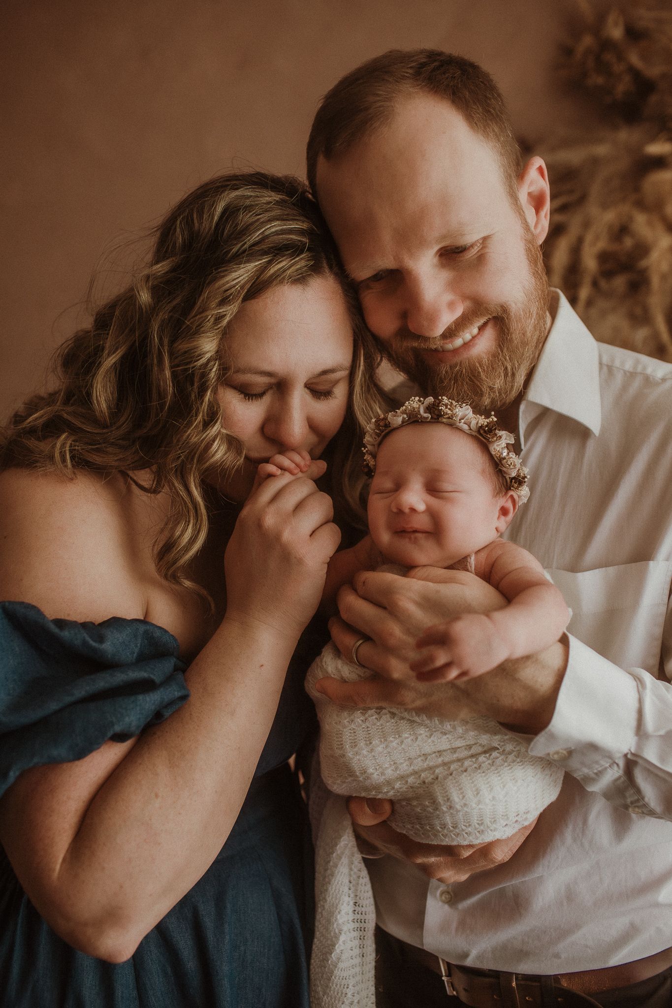 Intimate family portrait sequence in warm sepia tones showing tender moments.
