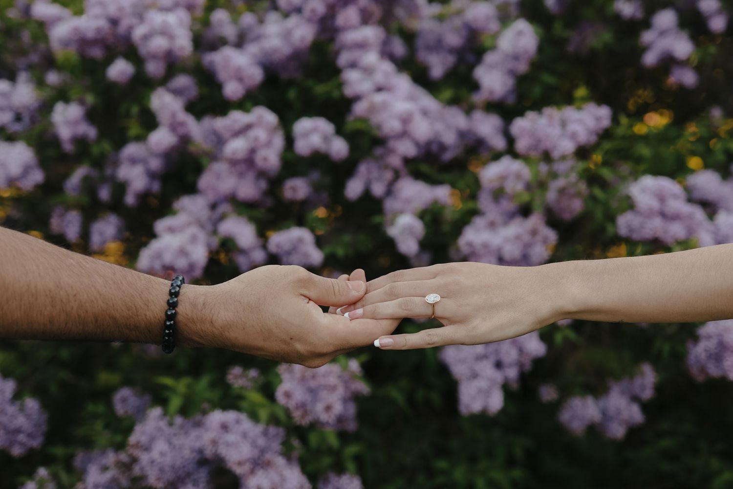 Intimate moment captured between couple during romantic outdoor photoshoot.