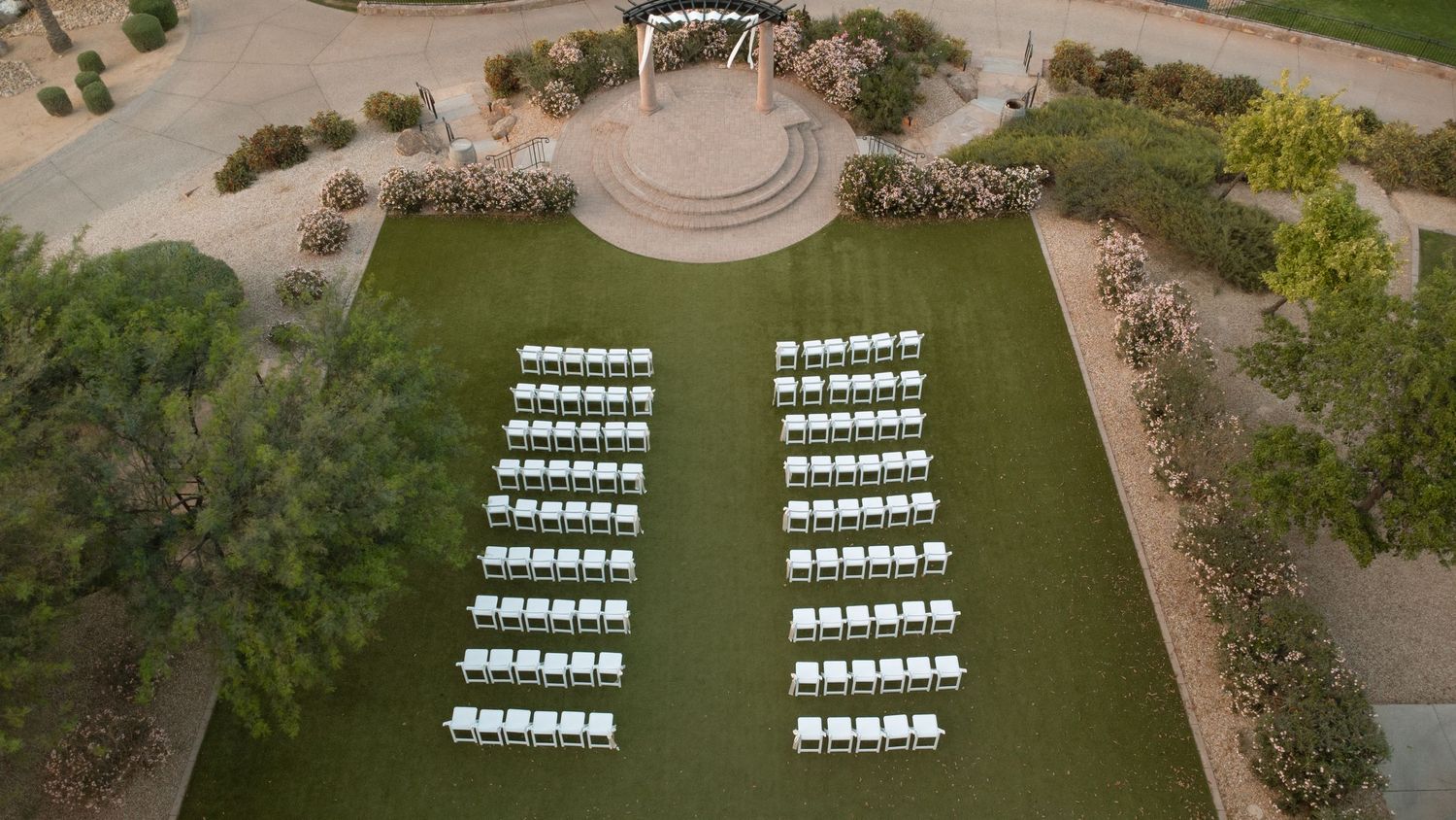 Bride and groom exchange vows on red rocks in Sedona, Arizona, with two flower girls and stunning butte views.