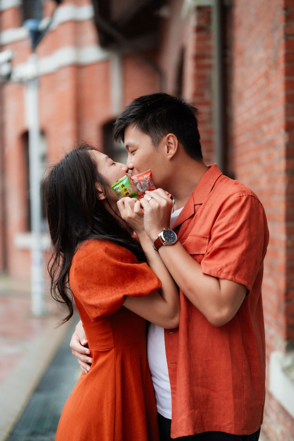 a couple in Ximending with their snacks