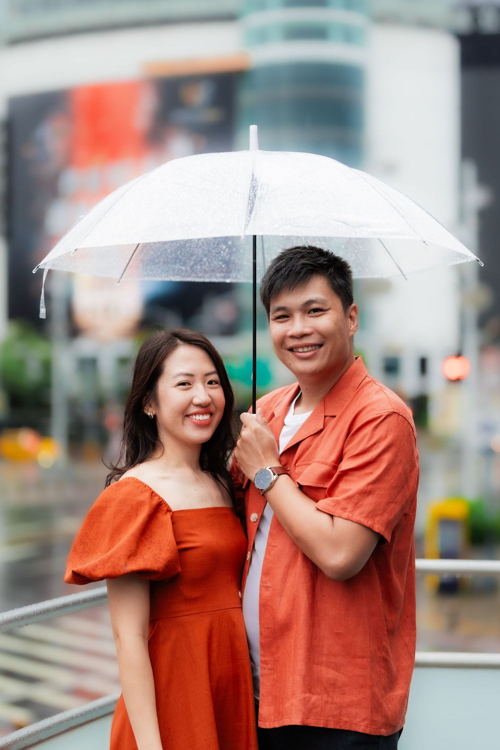 a couple in Ximending with an umbrella