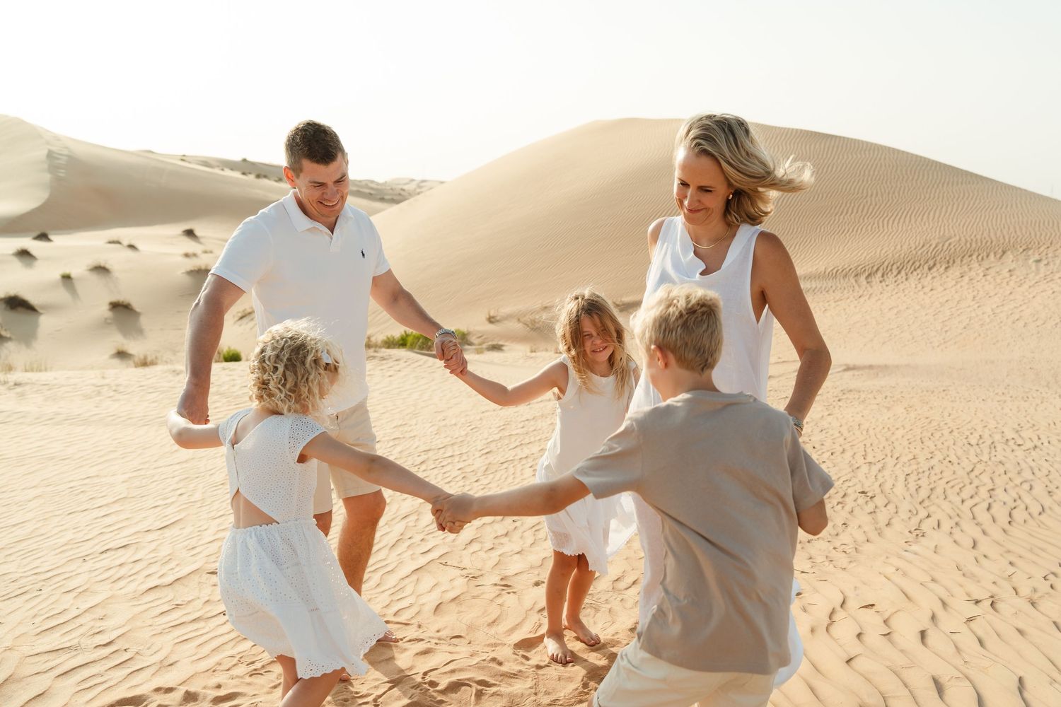 Abu Dhabi family Photographer desert photoshoot fun in the dunes