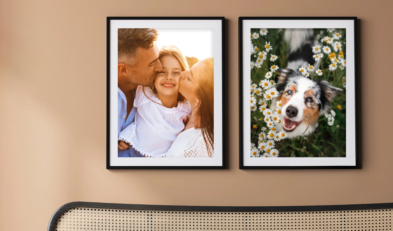 Two framed photos on a wall showing a family portrait and a dog with flowers.
