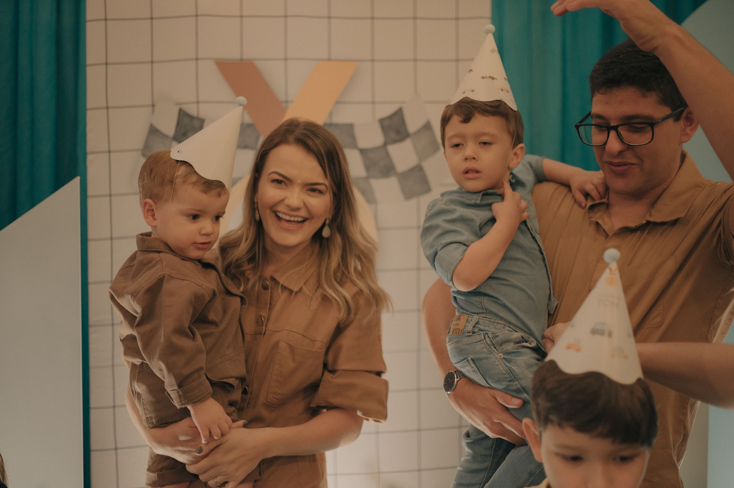 Family celebration scene with bunny ear decorations and playful atmosphere.