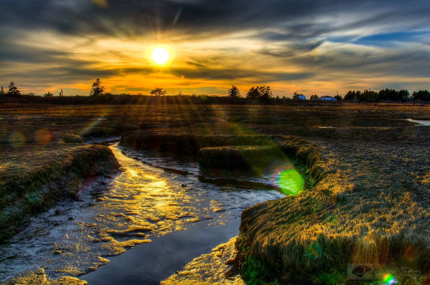 HDR image of a tidal stream at low tide during sunset.