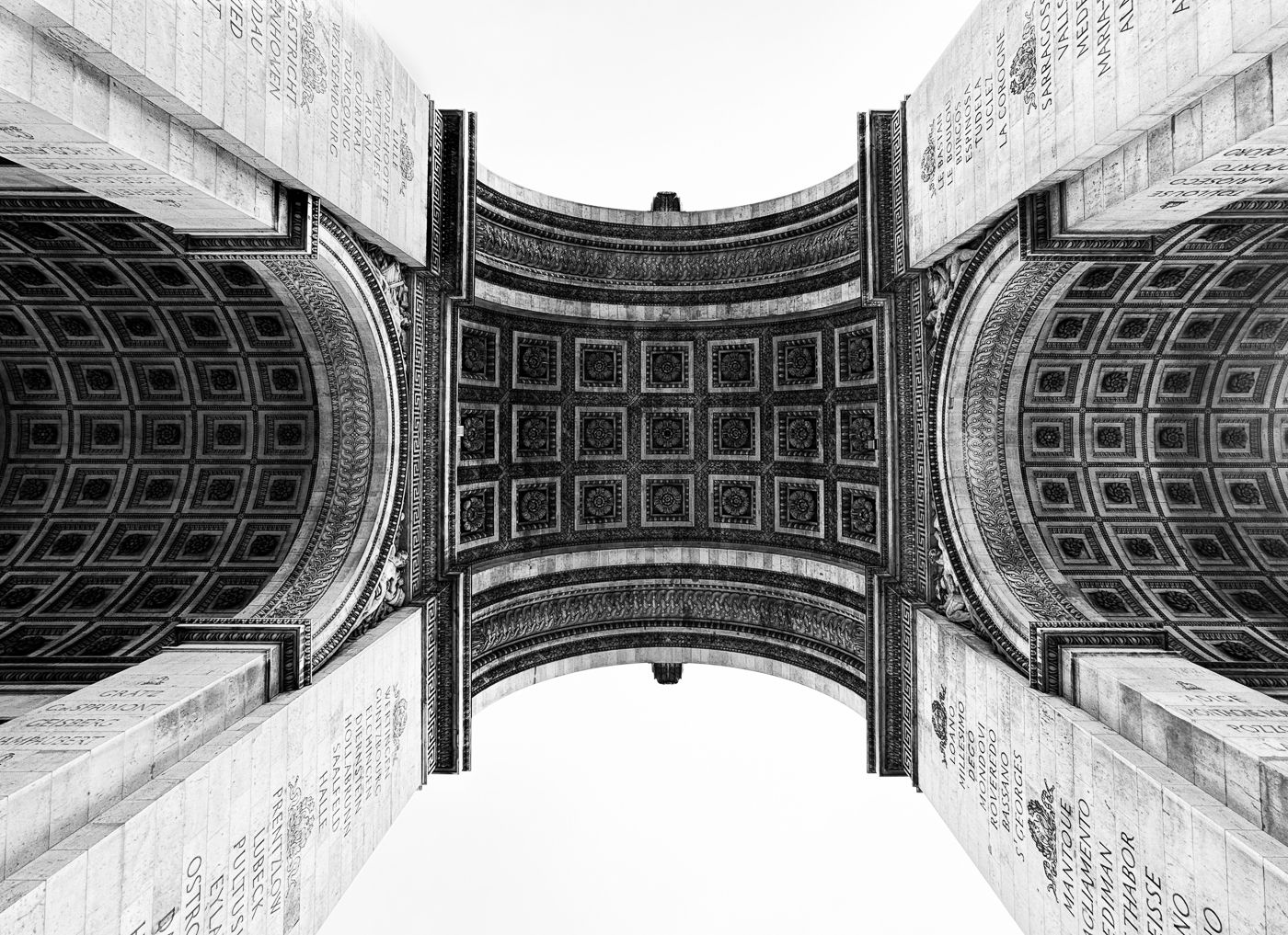 A Back and White photo of under the Arc De Triomphe